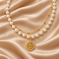 Pearl Virgin Mary Necklace – 15″ – Gold Plated — close-up sobre satén