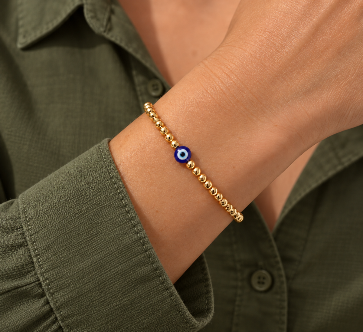 Amara Evil Eye Bracelet worn on wrist with modern everyday clothing