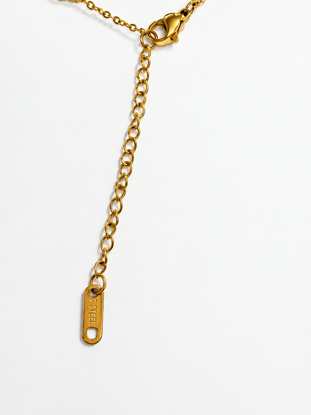 Bracelet extender chain, lobster clasp, and ST STEEL tag detail