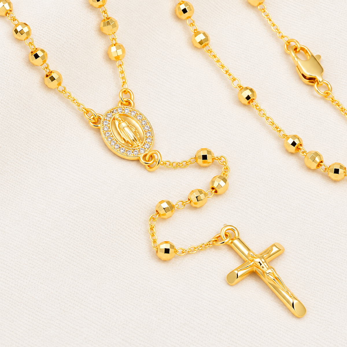 Clara Classic Gold-Plated Rosary close-up – faceted beads and religious medal