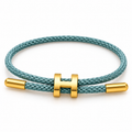 Bar & Nail Cord Bracelet — close-up on white background
