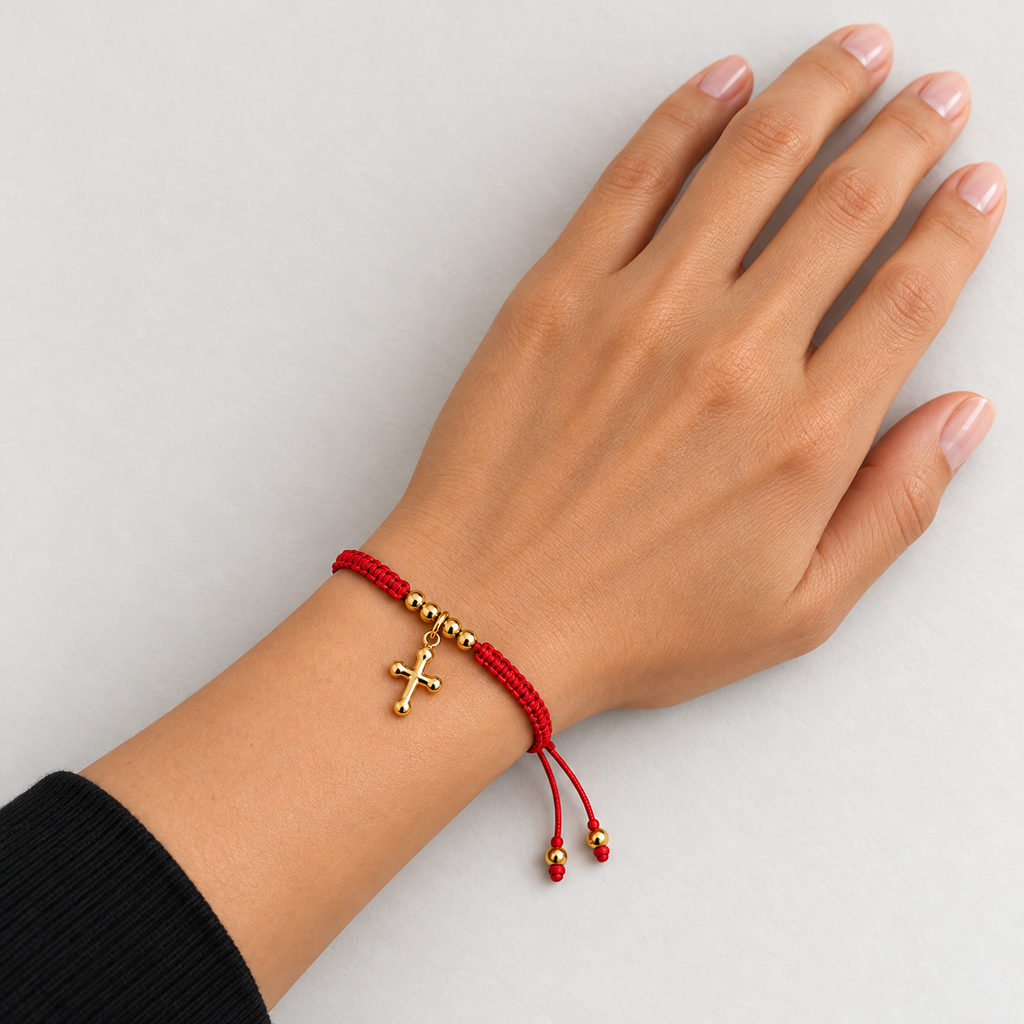 Cross Cord Bracelet worn on a relaxed hand and wrist resting on a neutral surface