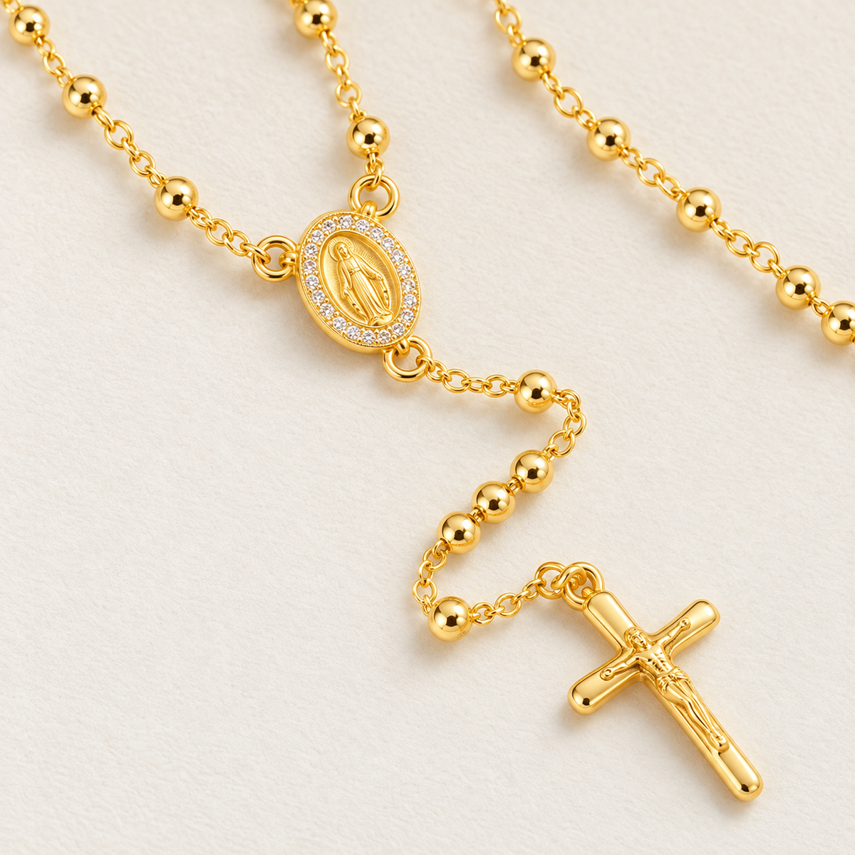 Grace Petite Gold-Plated Rosary — close-up of 3 mm beads, Virgin Mary medal and crucifix