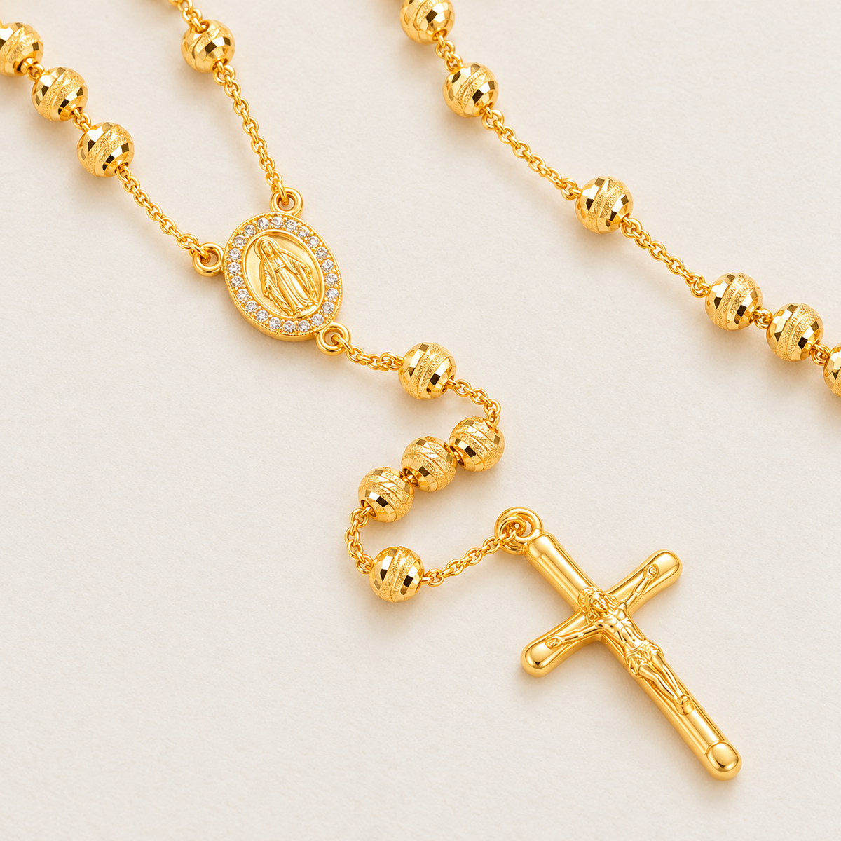Lucia Grande Gold-Plated Rosary — close-up of 5 mm beads, Virgin Mary medal and crucifix