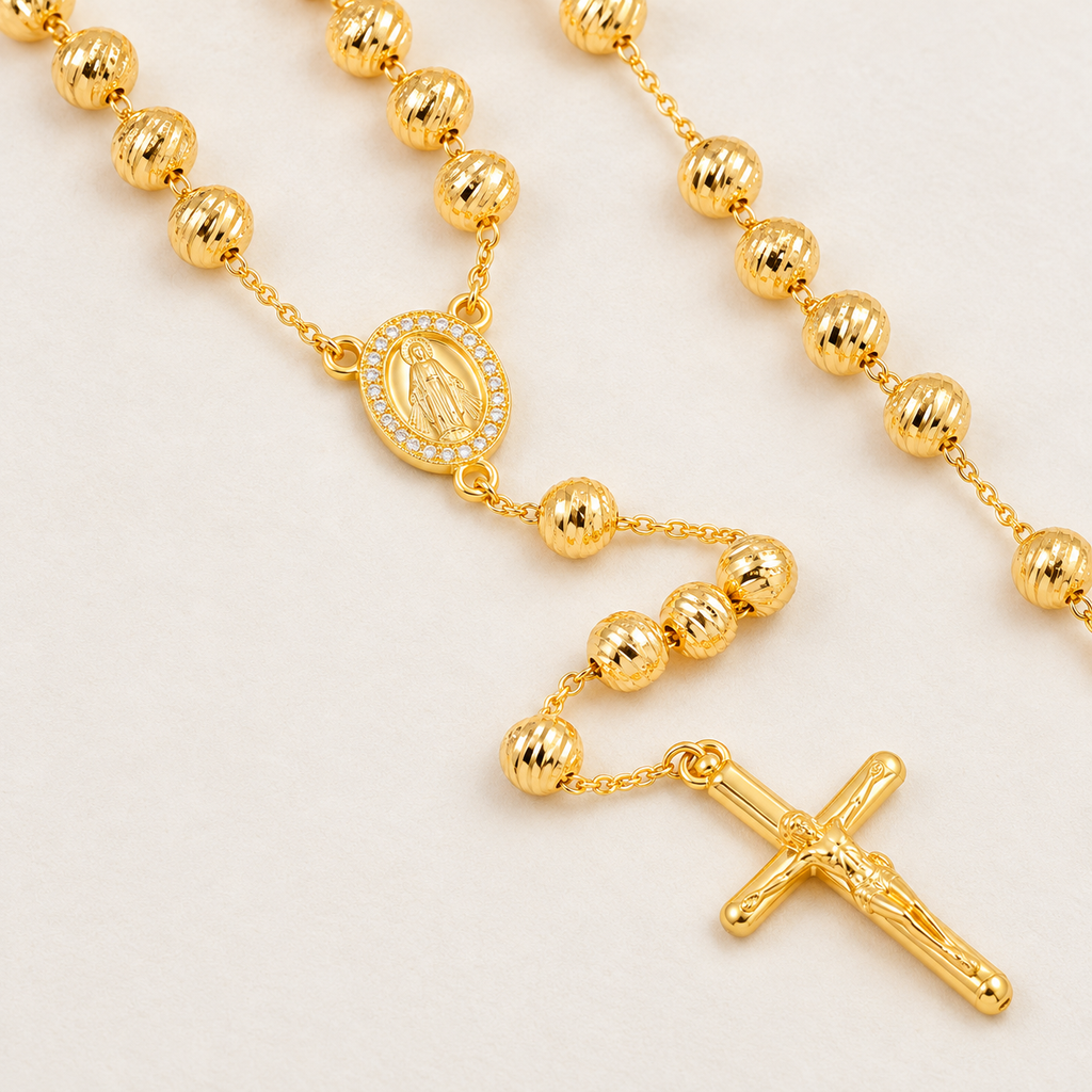 Lucia Bold Gold-Plated Rosary — close-up of 6 mm beads, Virgin Mary medal and crucifix