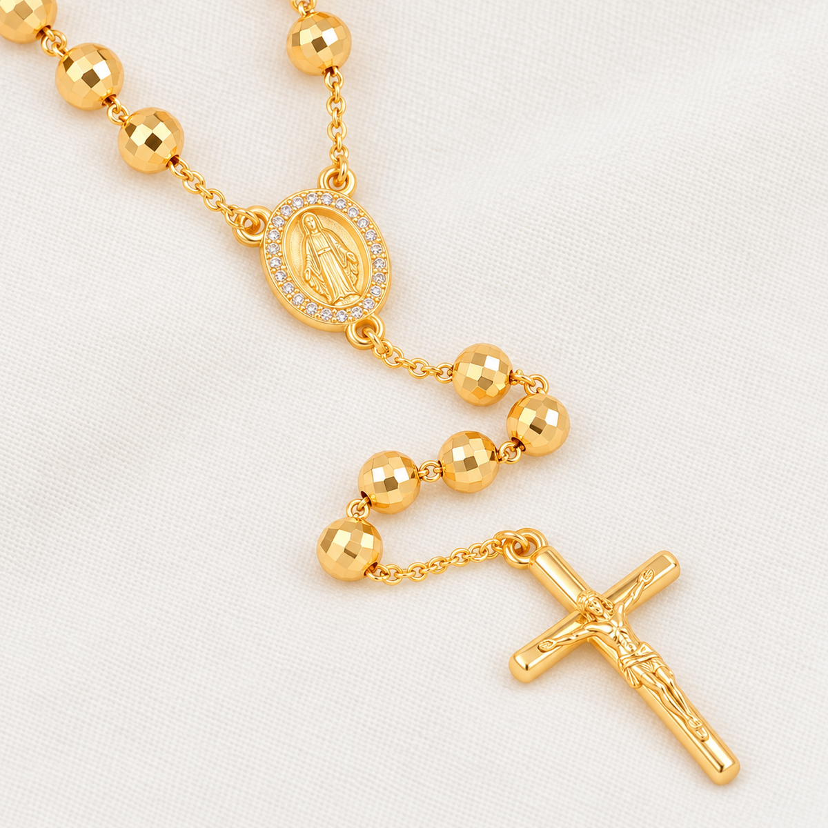 Clara Bold Gold-Plated Rosary — close-up of beads, Virgin Mary medal and crucifix