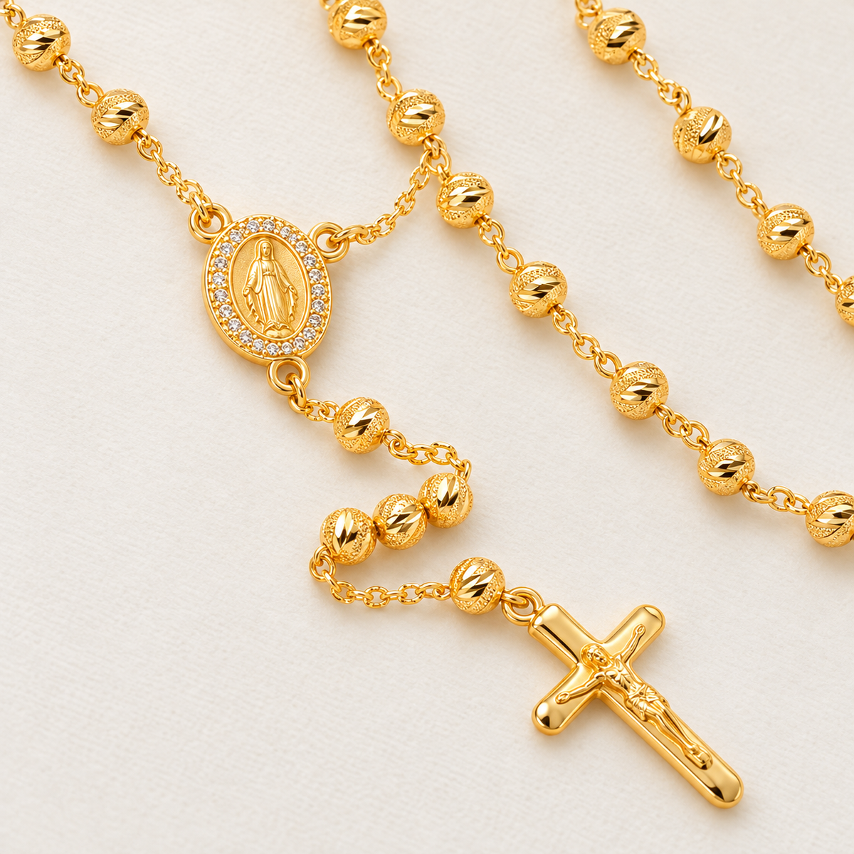 Lucia Classic Gold-Plated Rosary close-up – textured beads and crucifix