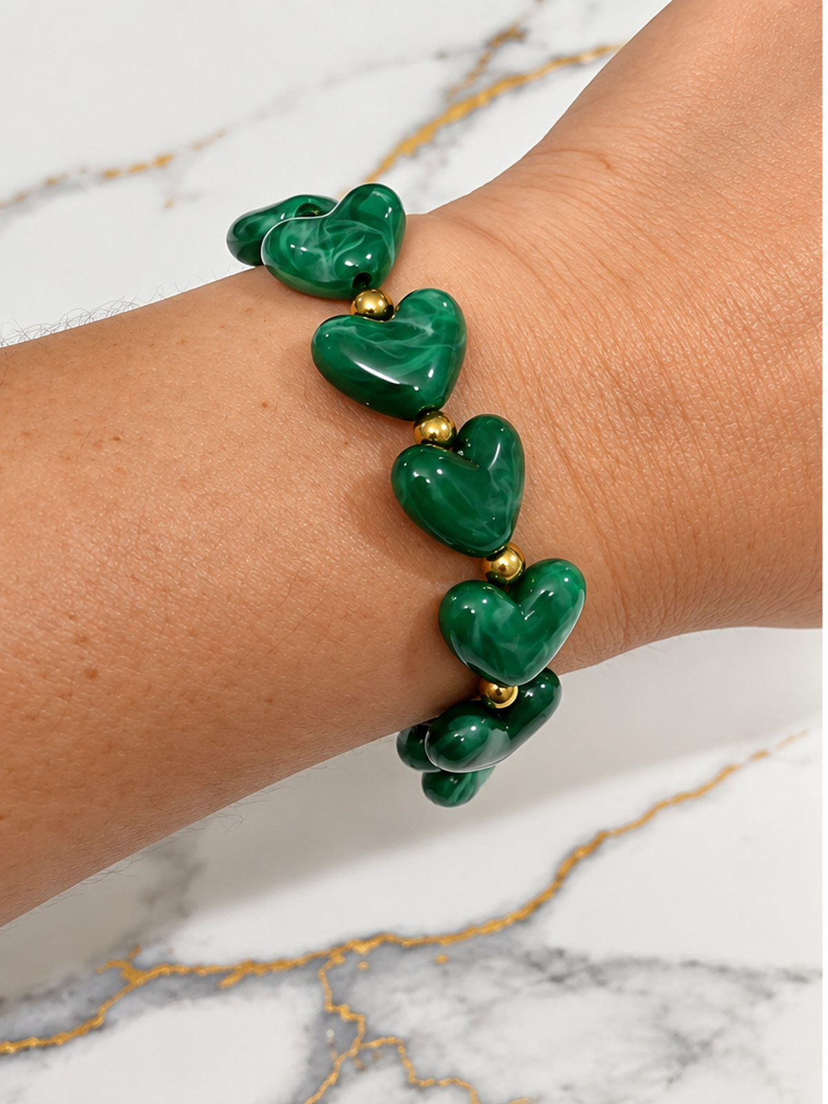Odette Heart Bracelet on wrist - green heart beads