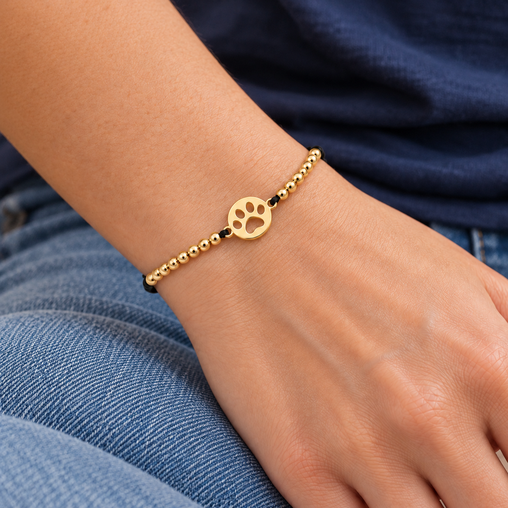 Paw Print Cord Bracelet worn with casual everyday clothing
