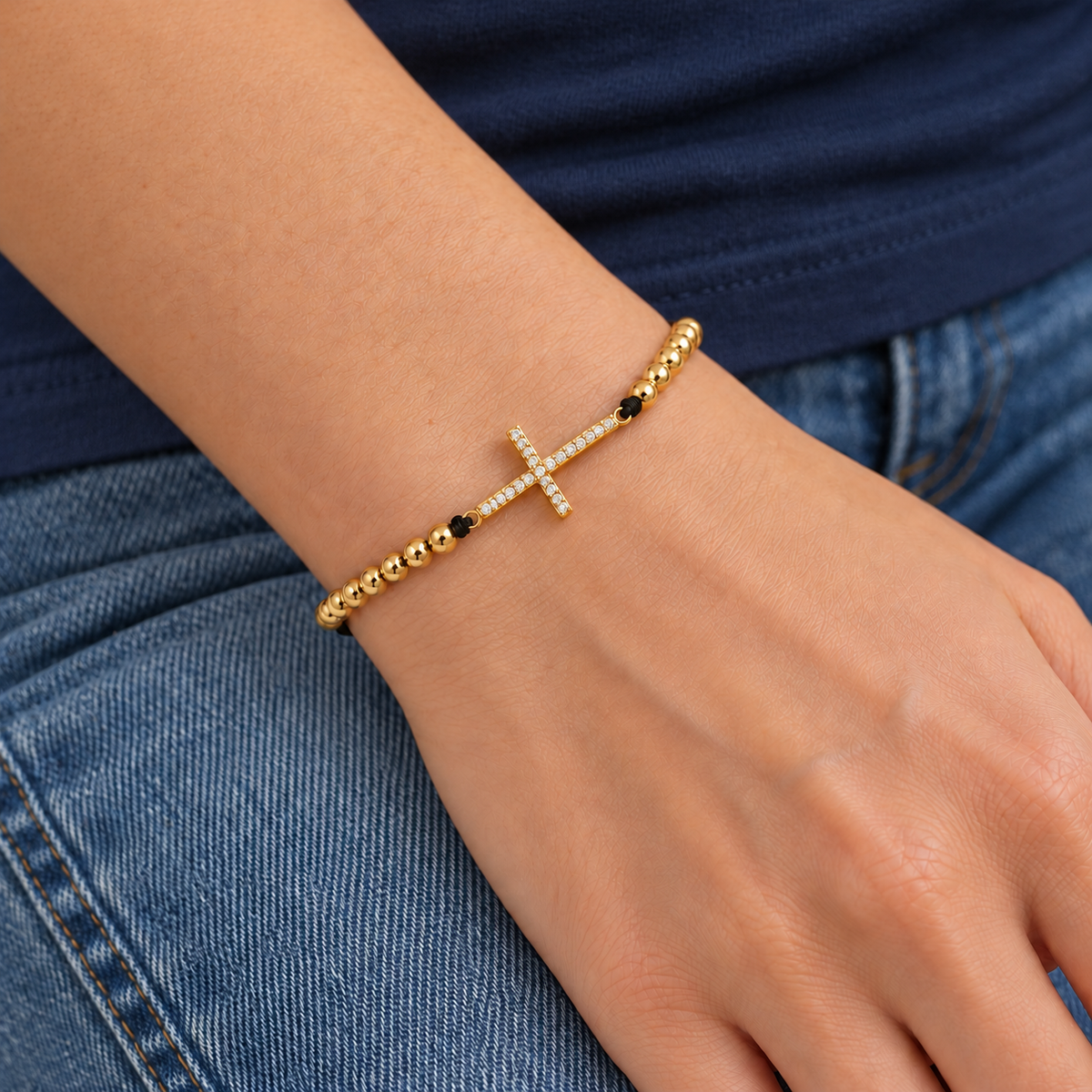 Sparkling Cross Cord Bracelet — try-on with modern dark clothing