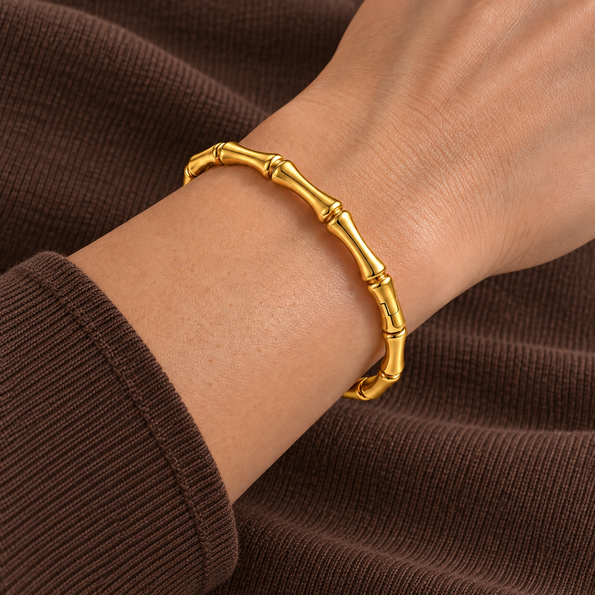 Vela Bracelet worn on wrist with modern everyday clothing